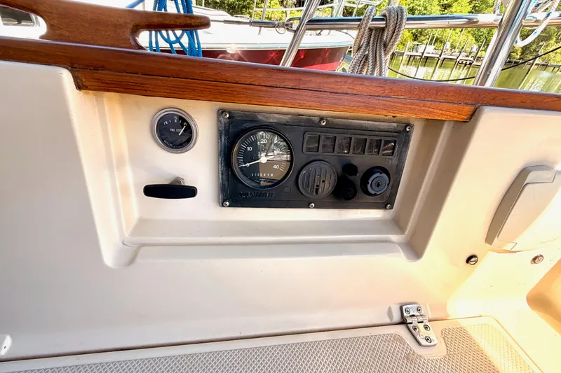 Slide: The Image of 1992 Island Packet 29 sailboat dashboard with gauges and controls. - 7