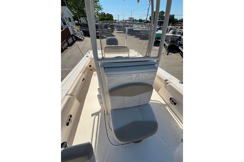Slide: The Image of 2015 Robalo 246 Cayman boat interior with seating and console view. - 13