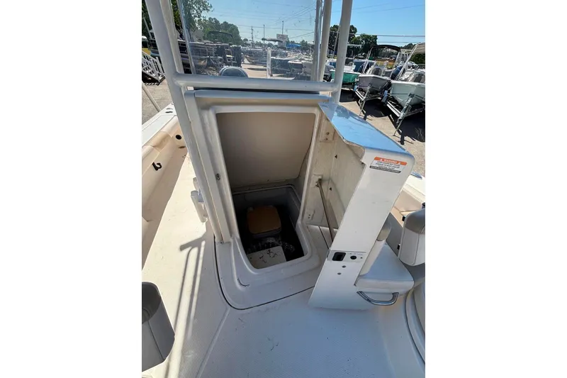 Slide: The Image of 2015 Robalo 246 Cayman boat interior storage compartment with open hatch. - 14