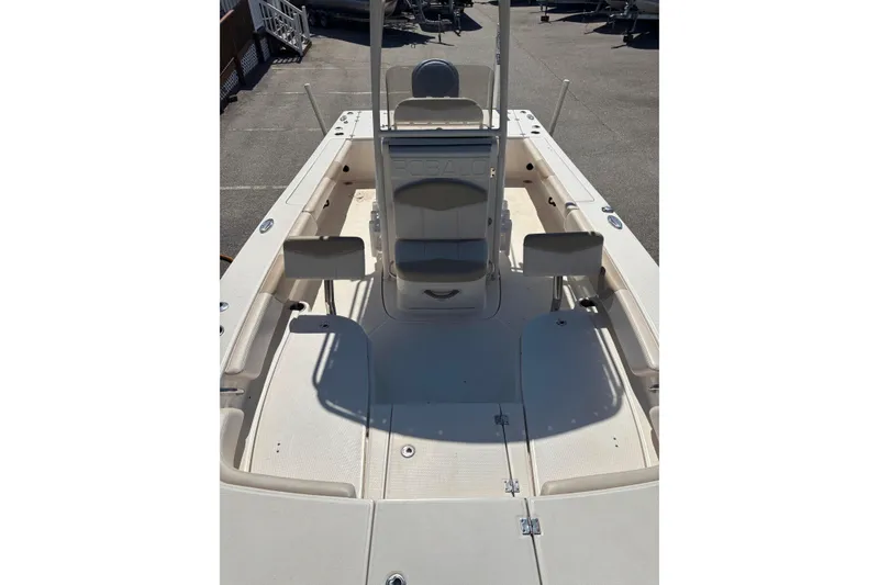 Slide: The Image of 2015 Robalo 246 Cayman boat interior with seating and console, viewed from above. - 7
