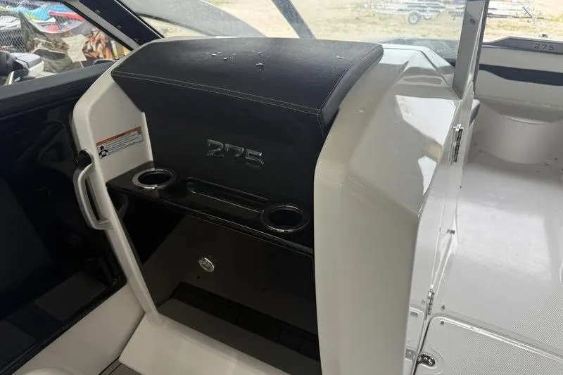 Slide: The Image of Interior of 2026 Yamaha Boats 275SD, featuring sleek seating and cup holders. - 10