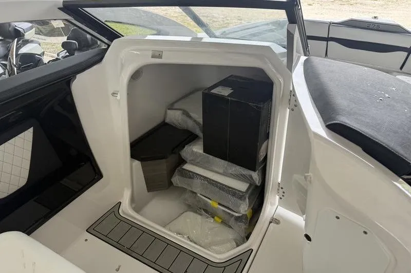 Slide: The Image of Storage compartment of 2026 Yamaha Boats 275SD, showcasing interior space and packaging. - 11