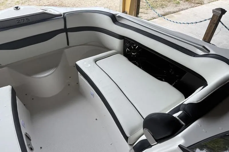 Slide: The Image of Interior seating of 2026 Yamaha Boats 275SD, featuring sleek white and black upholstery. - 13