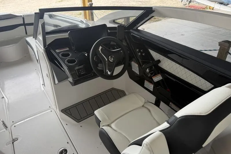 Slide: The Image of 2026 Yamaha Boats 275SD cockpit with modern steering and sleek interior design. - 5