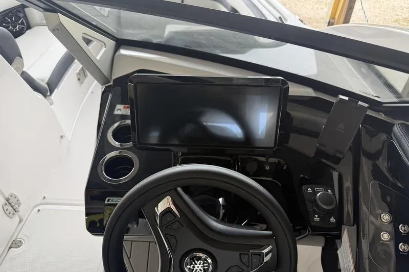 Slide: The Image of 2026 Yamaha Boats 275SD dashboard with steering wheel and touchscreen display. - 8