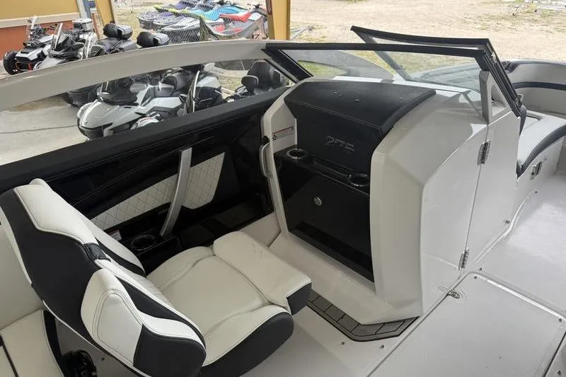Slide: The Image of Interior of 2026 Yamaha Boats 275SD, featuring sleek seating and modern dashboard design. - 9