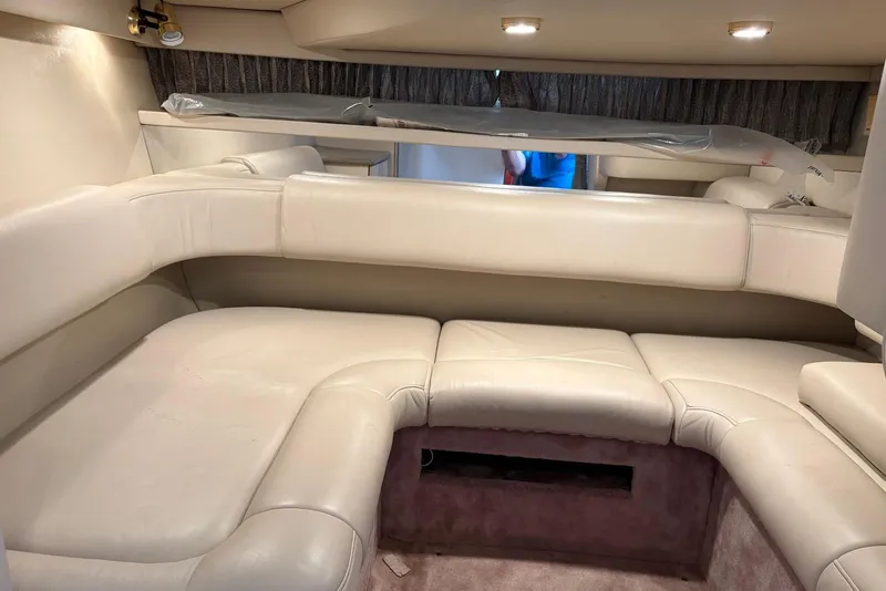 Slide: The Image of Interior of a 2001 Formula 34 Performance Cruiser with beige leather seating. - 12