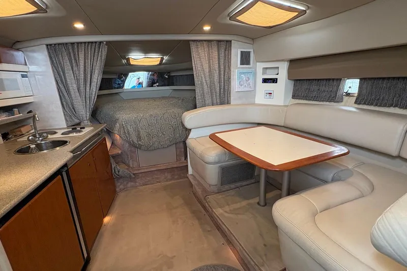 Slide: The Image of Interior of a 2001 Formula 34 Performance Cruiser with kitchenette and seating area. - 14
