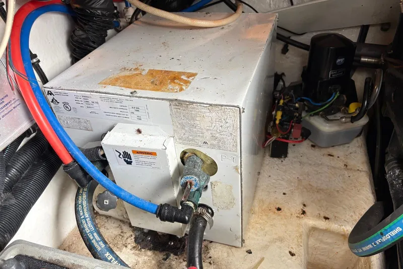 Slide: The Image of Engine compartment of a 2001 Formula 34 Performance Cruiser with wiring and equipment. - 25