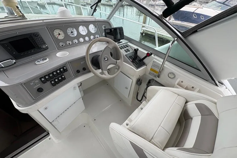 Slide: The Image of Cockpit of a 2001 Formula 34 Performance Cruiser with steering wheel and control panel. - 4