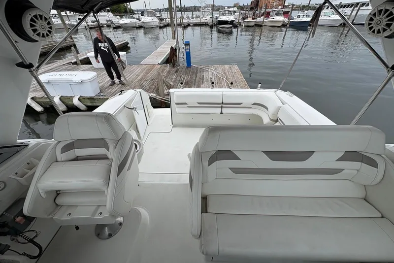 Slide: The Image of 2001 Formula 34 Performance Cruiser interior with white seating at marina dock. - 7