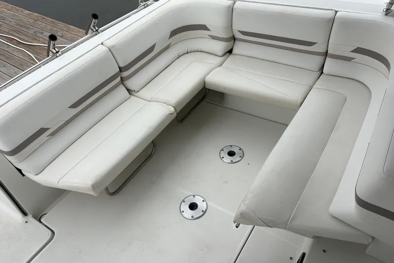 Slide: The Image of 2001 Formula 34 Performance Cruiser interior seating with white upholstery and sleek design. - 8