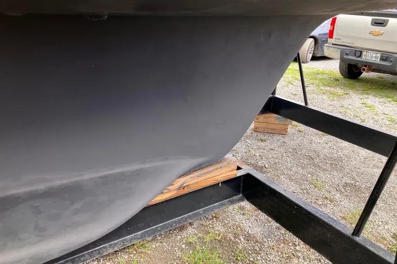 Slide: The Image of Close-up of a 1994 Sabre 362 boat hull on a trailer. - 11