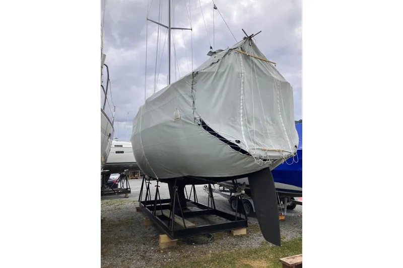 Slide: The Image of Covered 1994 Sabre 362 sailboat on a stand, ready for storage or transport. - 15
