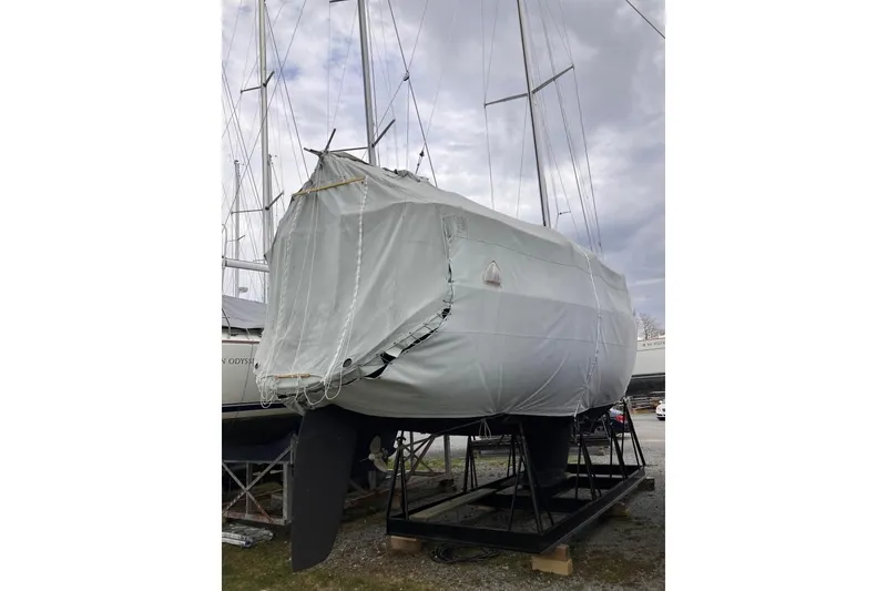 Slide: The Image of 1994 Sabre 362 sailboat covered and stored on a stand, ready for maintenance. - 16