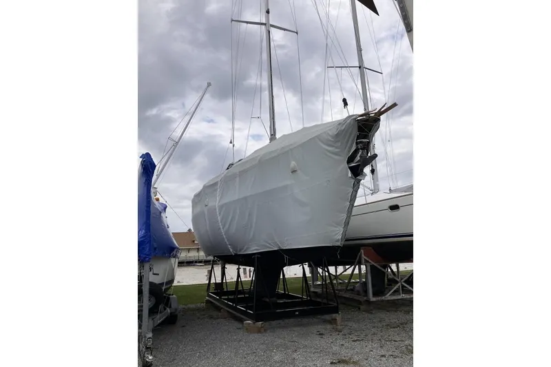 Slide: The Image of 1994 Sabre 362 sailboat docked and covered at the marina. - 17