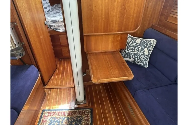 Slide: The Image of Interior of 1994 Sabre 362 sailboat with wooden finish and blue seating. - 22