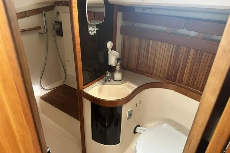 Slide: The Image of Bathroom interior of 1994 Sabre 362 yacht with wooden accents and shower area. - 24