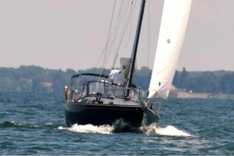 Slide: The Image of Sailing yacht Sabre 362 from 1994 navigating on open water. - 8