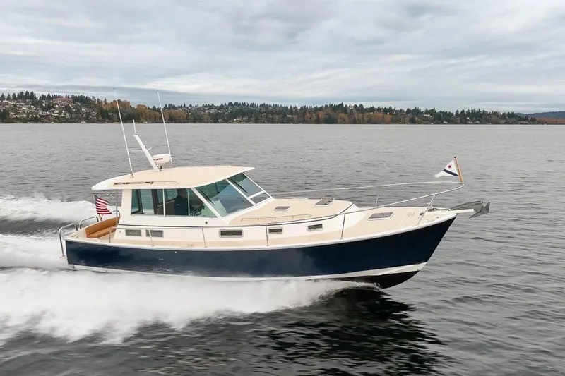 Slide: The Image of 2007 Bruckmann BLUESTAR boat cruising on a lake under cloudy skies. - 5