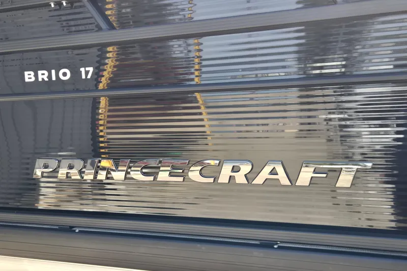 Slide: The Image of 2026 Princecraft Brio 17 Electric boat logo on metallic surface. - 3