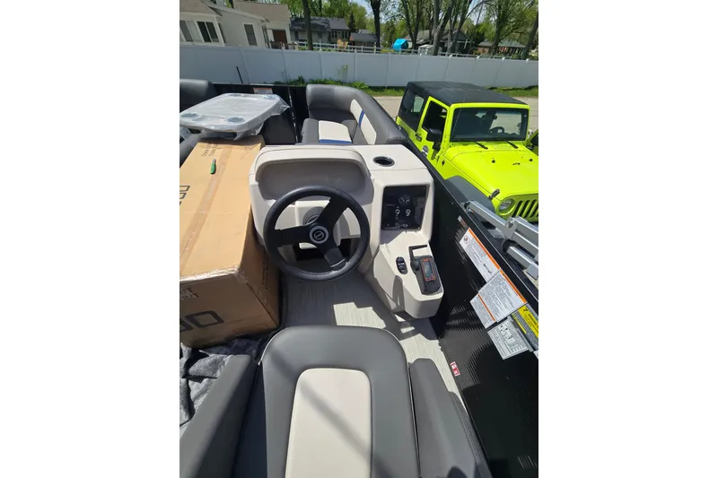 Slide: The Image of 2026 Princecraft Brio 17 Electric boat interior with steering wheel and controls. - 6