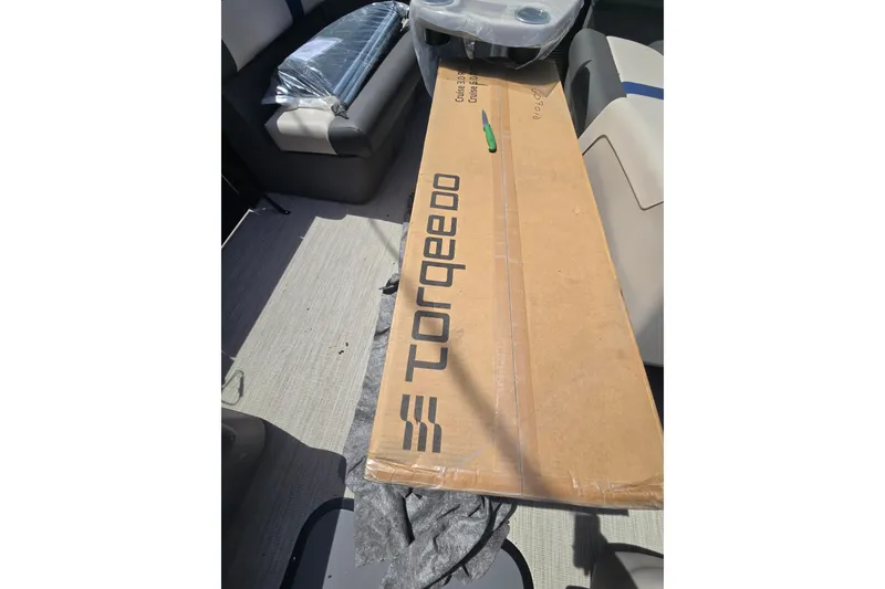 Slide: The Image of Cardboard box labeled "Torqeedo" on a 2026 Princecraft Brio 17 Electric boat. - 9