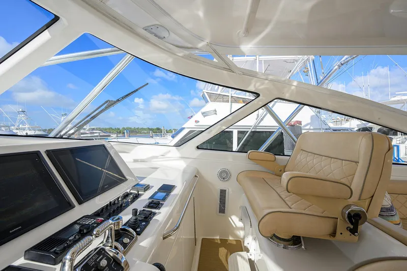 Slide: The Image of Interior of 2015 Viking 52 Open yacht with luxurious helm and navigation equipment. - 36
