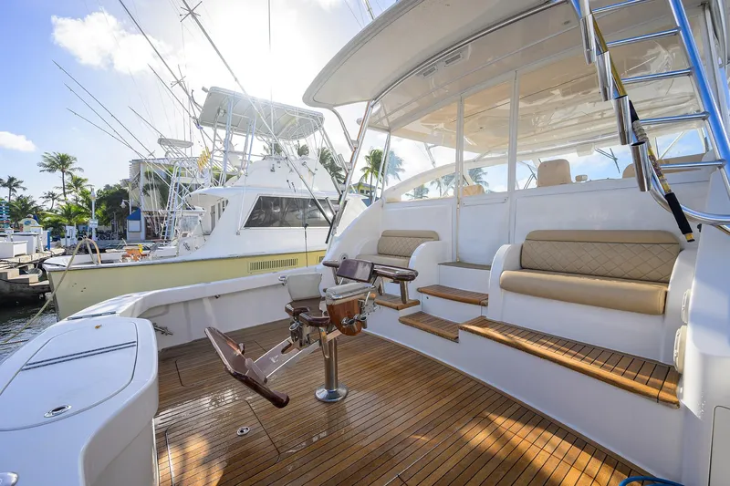 Slide: The Image of 2015 Viking 52 Open yacht with teak deck and fishing chair in marina. - 41