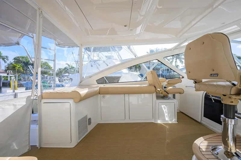 Slide: The Image of Luxurious interior of 2015 Viking 52 Open yacht with beige seating and helm station. - 49