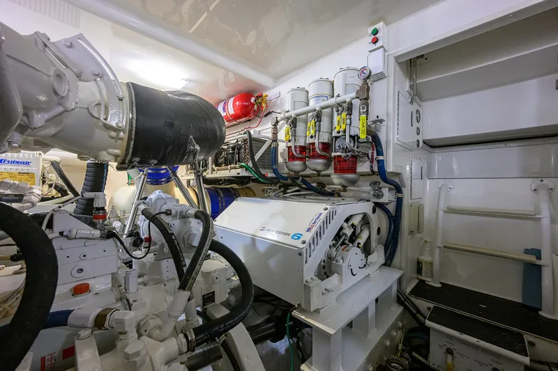 Slide: The Image of Engine room of 2015 Viking 52 Open yacht, showcasing mechanical components and systems. - 77