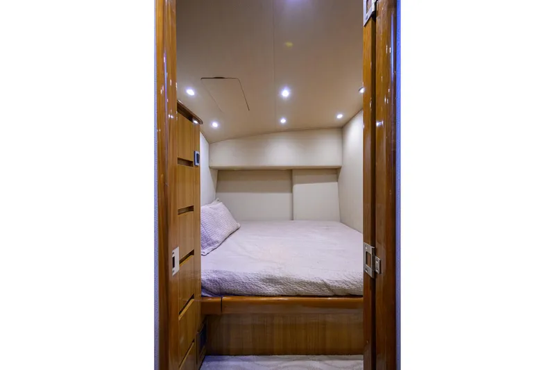 Slide: The Image of Interior cabin of 2015 Viking 52 Open yacht with cozy bed and wooden finish. - 83