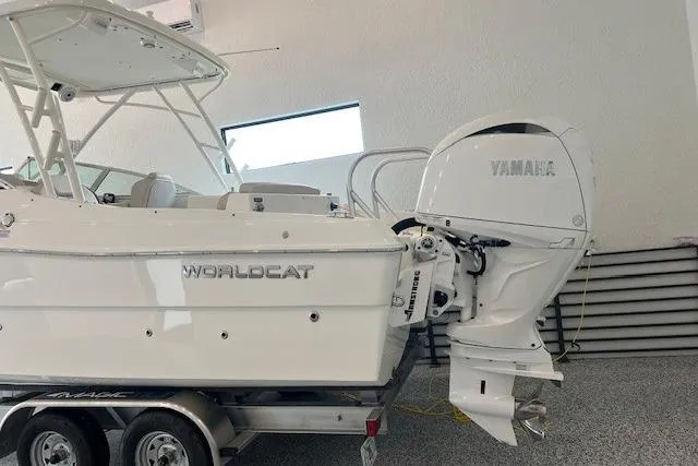 Slide: The Image of 2026 World Cat 230 SD boat with Yamaha outboard motor on trailer in showroom. - 15