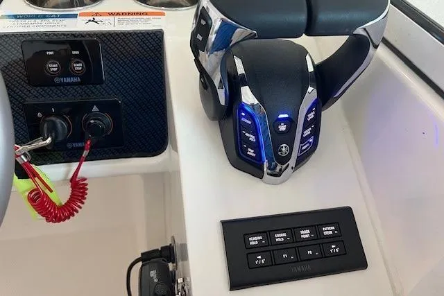 Slide: The Image of Control panel of 2026 World Cat 230 SD boat with Yamaha throttle and switches. - 3