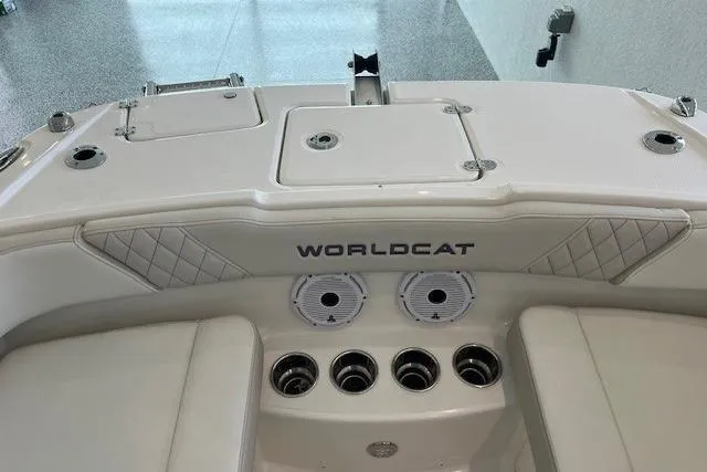 Slide: The Image of 2026 World Cat 230 SD boat interior with storage compartments and speaker system. - 9