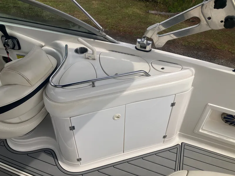 Slide: The Image of Interior of a 2006 Monterey 263 ES boat with seating and storage. - 11