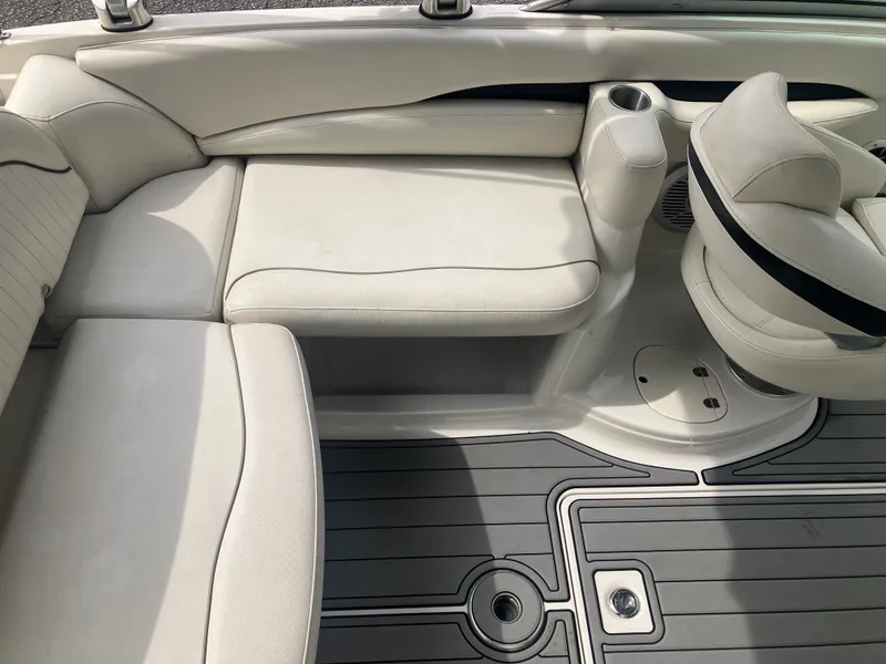 Slide: The Image of Interior of a 2006 Monterey 263 ES boat with white seating. - 12