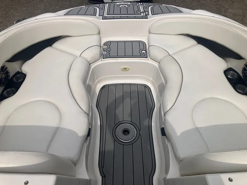 Slide: The Image of Interior of a 2006 Monterey 263 ES boat with white seating. - 17