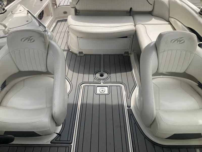 Slide: The Image of Interior of a 2006 Monterey 263 ES boat with white seating. - 20