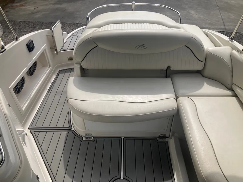 Slide: The Image of Interior of a 2006 Monterey 263 ES boat with white seating. - 21
