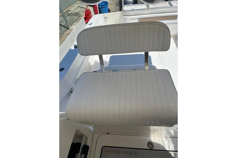 Slide: The Image of White cushioned seat on 2005 Contender 31 Fisharound boat deck. - 10