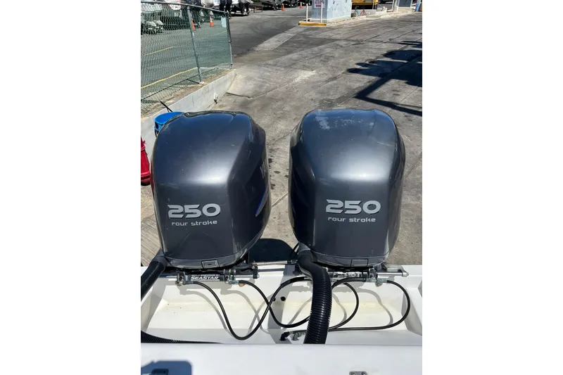 Slide: The Image of Twin 250 horsepower four-stroke outboard engines on a 2005 Contender 31 Fisharound boat. - 14