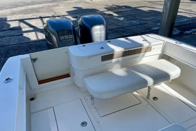 Slide: The Image of 2005 Contender 31 Fisharound boat with twin 250 engines and white seating. - 4