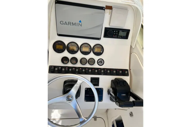 Slide: The Image of Dashboard of a 2005 Contender 31 Fisharound with Garmin navigation system. - 8