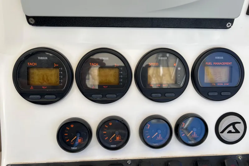 Slide: The Image of Dashboard of a 2005 Contender 31 Fisharound with Yamaha gauges and controls. - 9