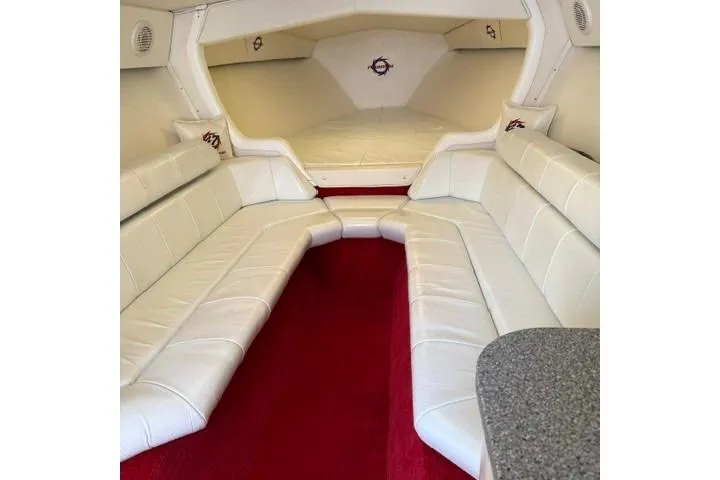 Slide: The Image of Interior of 2000 Fountain 47 Lightning boat with white seating and red carpet. - 23