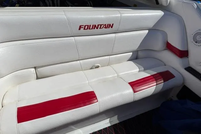 Slide: The Image of White and red seating in a 2000 Fountain 47 Lightning boat. - 25