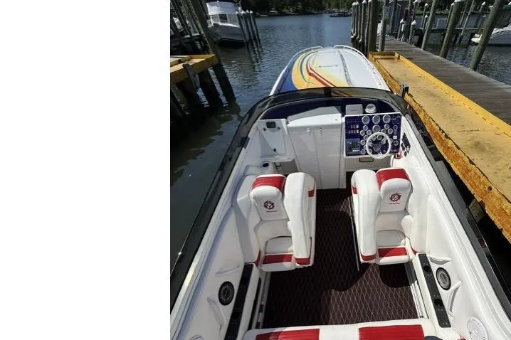 Slide: The Image of 2000 Fountain 47 Lightning speedboat interior with dual seats and control panel. - 38