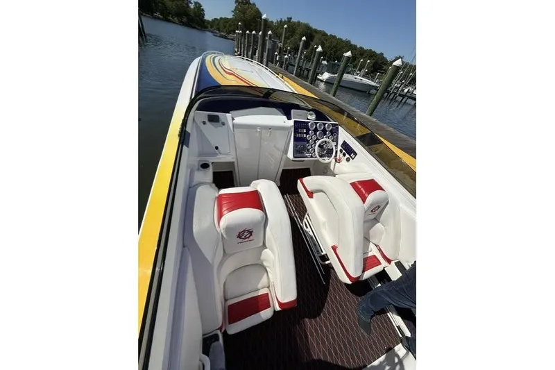 Slide: The Image of Interior of a 2000 Fountain 47 Lightning speedboat with white and red seating. - 41