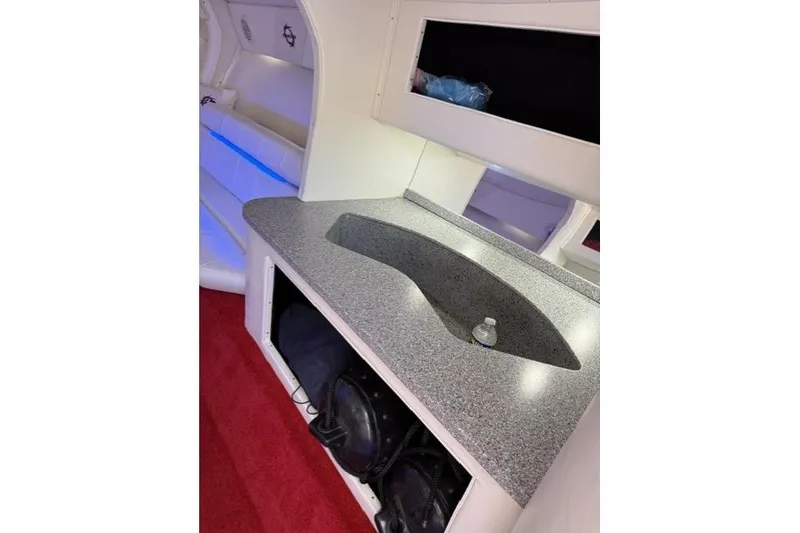 Slide: The Image of Interior of 2000 Fountain 47 Lightning boat with countertop and seating area. - 43